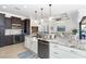 Open kitchen with large island, stainless steel appliances, and views to Gathering room at 85 Spaniards Rd, Placida, FL 33946