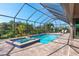 Relaxing screened pool and spa with ample deck space at 85 Spaniards Rd, Placida, FL 33946