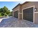 Two-car garage with paver driveway and exterior lighting at 85 Spaniards Rd, Placida, FL 33946
