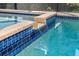 Close-up of a waterfall feature in the pool area at 85 Spaniards Rd, Placida, FL 33946