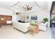 Living room with coffered ceiling, comfy seating, and view to pool at 85 Spaniards Rd, Placida, FL 33946