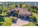 Single-Gathering home with tile roof and paver driveway at 85 Spaniards Rd, Placida, FL 33946