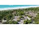 Beachfront property with lush vegetation and white sand at 85 Spaniards Rd, Placida, FL 33946