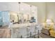 Modern kitchen with white cabinets, quartz countertops, and stainless steel appliances at 5644 Ashton Lake Dr # 5644, Sarasota, FL 34231