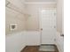 Laundry room includes a door, shelving and tile flooring at 11814 Colyar Ln, Parrish, FL 34219