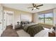 Main bedroom with water view and a staged bed at 11814 Colyar Ln, Parrish, FL 34219