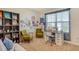 Home office with a desk, two chairs, and built-in shelving at 12703 Night View Dr, Sarasota, FL 34238