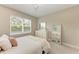 Spacious bedroom with a queen-size bed and dresser at 13902 Messina Loop, Bradenton, FL 34211