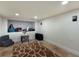 Finished basement with storage, a small sitting area, and tile flooring at 1521 Siesta Dr, Sarasota, FL 34239