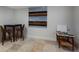 Small basement room with a table, chairs, and wall art at 1521 Siesta Dr, Sarasota, FL 34239