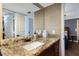 Bathroom with granite countertop and wood vanity at 1521 Siesta Dr, Sarasota, FL 34239