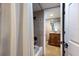 Bathroom with shower, tub, and granite vanity at 1521 Siesta Dr, Sarasota, FL 34239