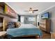 King-size bed in a bright bedroom with wood accent wall at 1521 Siesta Dr, Sarasota, FL 34239