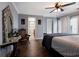 Spacious bedroom with ensuite bathroom access and ceiling fan at 1521 Siesta Dr, Sarasota, FL 34239