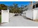 Private driveway with gate, boat, and golf cart storage at 1521 Siesta Dr, Sarasota, FL 34239