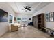 Living room with comfortable seating and built-in shelving at 1521 Siesta Dr, Sarasota, FL 34239