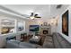 Living Room with fireplace, sectional sofa, and hardwood floors at 1521 Siesta Dr, Sarasota, FL 34239