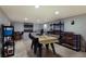 Basement workshop with CNC router, shelving, and work table at 1521 Siesta Dr, Sarasota, FL 34239