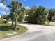 Private driveway entrance with tropical landscaping at 1827 Highland Rd, Osprey, FL 34229