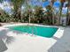 Sparkling community pool with surrounding foliage at 1827 Highland Rd, Osprey, FL 34229