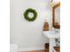 Powder room features pedestal sink, decorative mirror, neutral walls and tile floors at 1868 Scarlett Ave, North Port, FL 34289