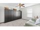 Bedroom with a large closet, neutral carpet, a light green sofa and a ceiling fan at 1868 Scarlett Ave, North Port, FL 34289