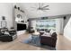 Comfortable living room with a view of the pool area through large sliding glass doors at 1868 Scarlett Ave, North Port, FL 34289