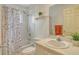 Updated bathroom with shower/tub combo, vanity, and decorative shower curtain at 381 Bobby Jones Rd # 381, Sarasota, FL 34232