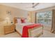 Bedroom with a queen bed, ample closet space, and natural light at 381 Bobby Jones Rd # 381, Sarasota, FL 34232