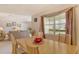 Dining area adjacent to living room, featuring large window at 381 Bobby Jones Rd # 381, Sarasota, FL 34232