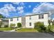 Two-story building exterior with landscaping and parking at 381 Bobby Jones Rd # 381, Sarasota, FL 34232