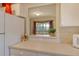 Kitchen with a pass-through to the dining area at 381 Bobby Jones Rd # 381, Sarasota, FL 34232