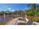 Tranquil patio with lake view and lounge chairs at 4134 Central Sarasota Pkwy # 1734, Sarasota, FL 34238