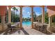 Inviting community pool with surrounding patio seating at 4134 Central Sarasota Pkwy # 1734, Sarasota, FL 34238