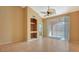 Bright living room with tiled floor and access to balcony at 4134 Central Sarasota Pkwy # 1734, Sarasota, FL 34238
