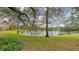 Scenic pond with lush green landscaping at 4134 Central Sarasota Pkwy # 1734, Sarasota, FL 34238