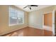 Bedroom with wood floors and large window at 4134 Central Sarasota Pkwy # 1734, Sarasota, FL 34238