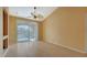 Bright living room with tiled floor and access to balcony at 4134 Central Sarasota Pkwy # 1734, Sarasota, FL 34238