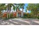 Community building with palm trees and brick paved parking at 4134 Central Sarasota Pkwy # 1734, Sarasota, FL 34238