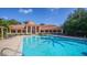 Community pool with clubhouse in background at 4134 Central Sarasota Pkwy # 1734, Sarasota, FL 34238