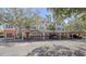 Three-story building with covered parking and lush landscaping at 4134 Central Sarasota Pkwy # 1734, Sarasota, FL 34238