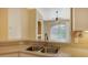 Kitchen features a double sink and views to the balcony at 4134 Central Sarasota Pkwy # 1734, Sarasota, FL 34238