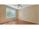 Bedroom with wood floors and large window at 4134 Central Sarasota Pkwy # 1734, Sarasota, FL 34238