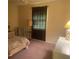 Bedroom with double bed, chair, and window at 449 Botticelli Dr # 449, Nokomis, FL 34275