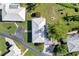 Aerial view of single-story home with tile roof, driveway, and mature landscaping at 449 Botticelli Dr # 449, Nokomis, FL 34275