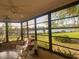 Sunroom with lake view, seating area, and ceiling fan at 449 Botticelli Dr # 449, Nokomis, FL 34275