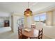 Charming dining room with wood table and stained glass light fixture at 4795 Independence Dr, Bradenton, FL 34210