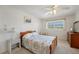 Cozy bedroom featuring a wood bed frame and window at 4795 Independence Dr, Bradenton, FL 34210