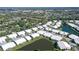 Aerial view of a residential community with well-maintained homes, lush greenery and serene ponds at 5395 Christie Ann Pl # 9, Sarasota, FL 34233