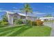 Attractive single-story home boasting a beautifully landscaped front yard with flowering bushes at 5395 Christie Ann Pl # 9, Sarasota, FL 34233